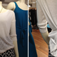 Illustration for article titled Pinning Clothing So It Fits the Mannequin Better Is The Devils Work